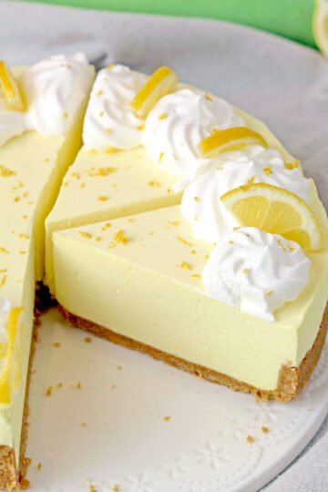 The Easiest Lemon Cheesecake - this no bake recipe with graham cracker crust, creamy cheesecake and lemon Jell-O filling is so quick and easy to make and it's perfect for Easter or any other holiday, as well as for hot summer days.