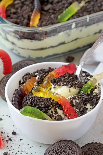 A fun and creamy chocolate pudding dessert layered with crushed Oreo cookies and gummy worms - perfect for kids, birthday parties, and Halloween.